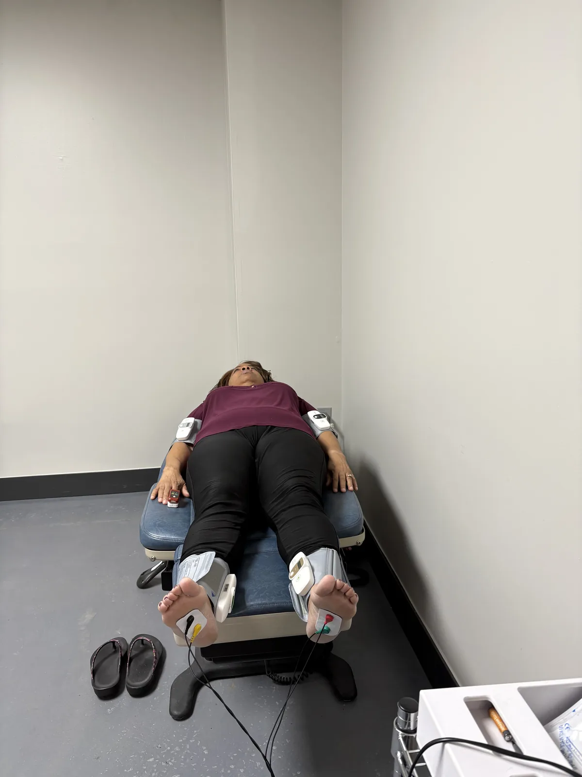 Patient reclined for small-fiber and autonomic nerve testing, with sensor cuffs on both ankles and wrists, at Regenerve, 4477 Woodson Rd, St. Louis, MO 63134